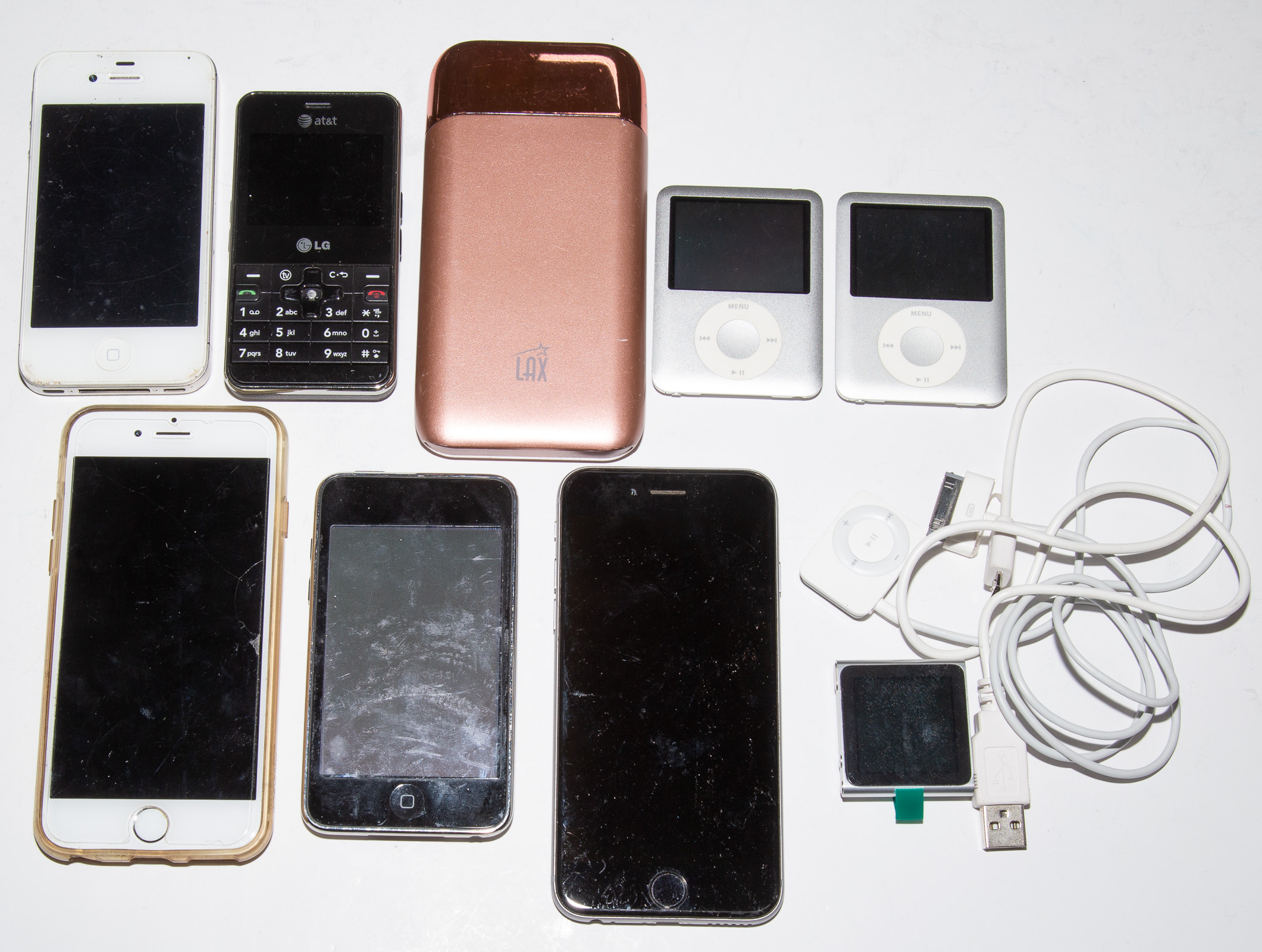 Appraisal: GROUP OF USED CELL PHONES With foreign coins iPods a