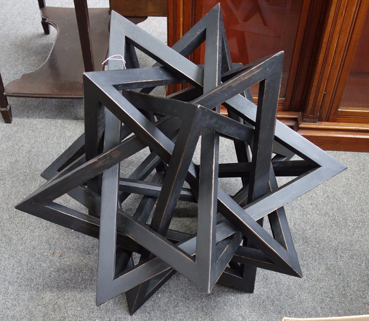 Appraisal: A stellar instalation late th century ebonised wood constructed of