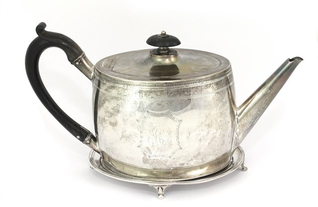 Appraisal: A George III silver teapot of oval barrelled form and