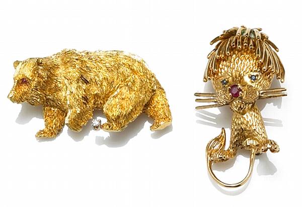 Appraisal: Two gem-set diamond k gold and gold-plated brooches comprising a