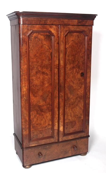 Appraisal: A Victorian burr walnut two door wardrobe the projected moulded