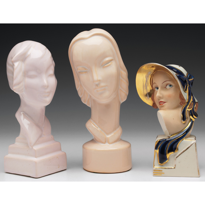 Appraisal: Art Pottery figurines two heads of women covered in an