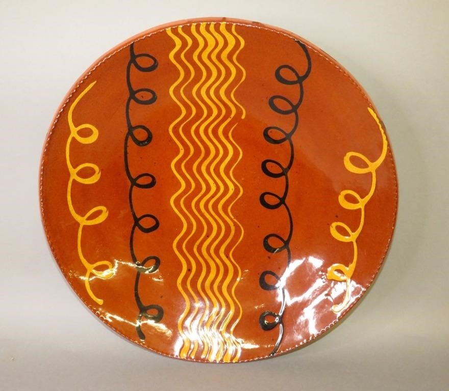 Appraisal: FINE TWO COLOR FLOWING SLIP FOLK ART CHARGER BY LEca