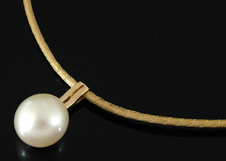 Appraisal: A South Sea pearl and diamond pendant The oval pearl