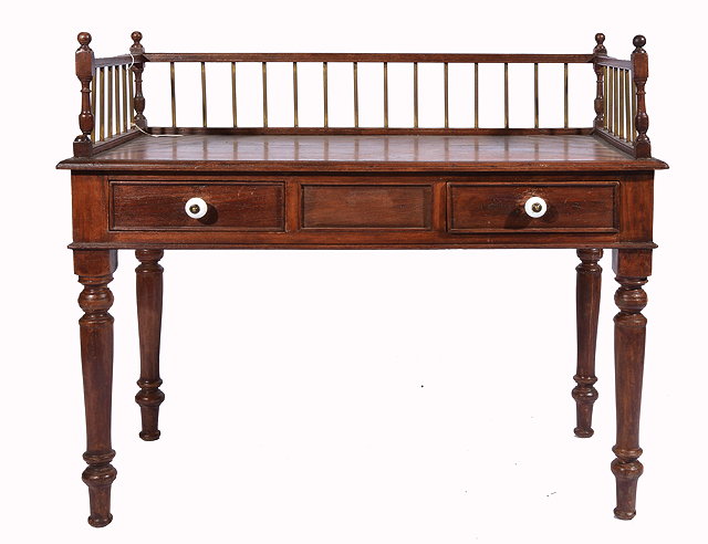 Appraisal: AN INDIAN HARDWOOD DESK with turned wooden and brass galleried