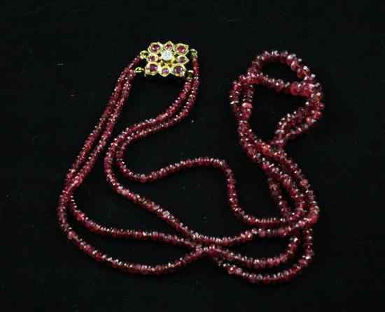 Appraisal: An Indian graduated facet cut ruby two strand necklace with