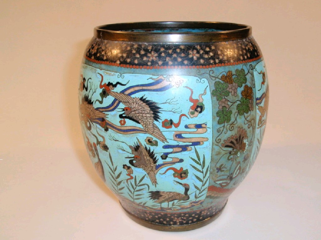 Appraisal: A cloisonn oval shaped vase decorated with reserves of cranes