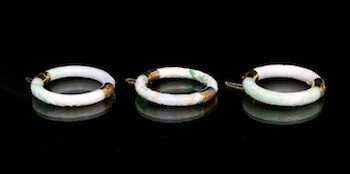 Appraisal: A Set of Three Carved Jade Bangle Bracelets with k