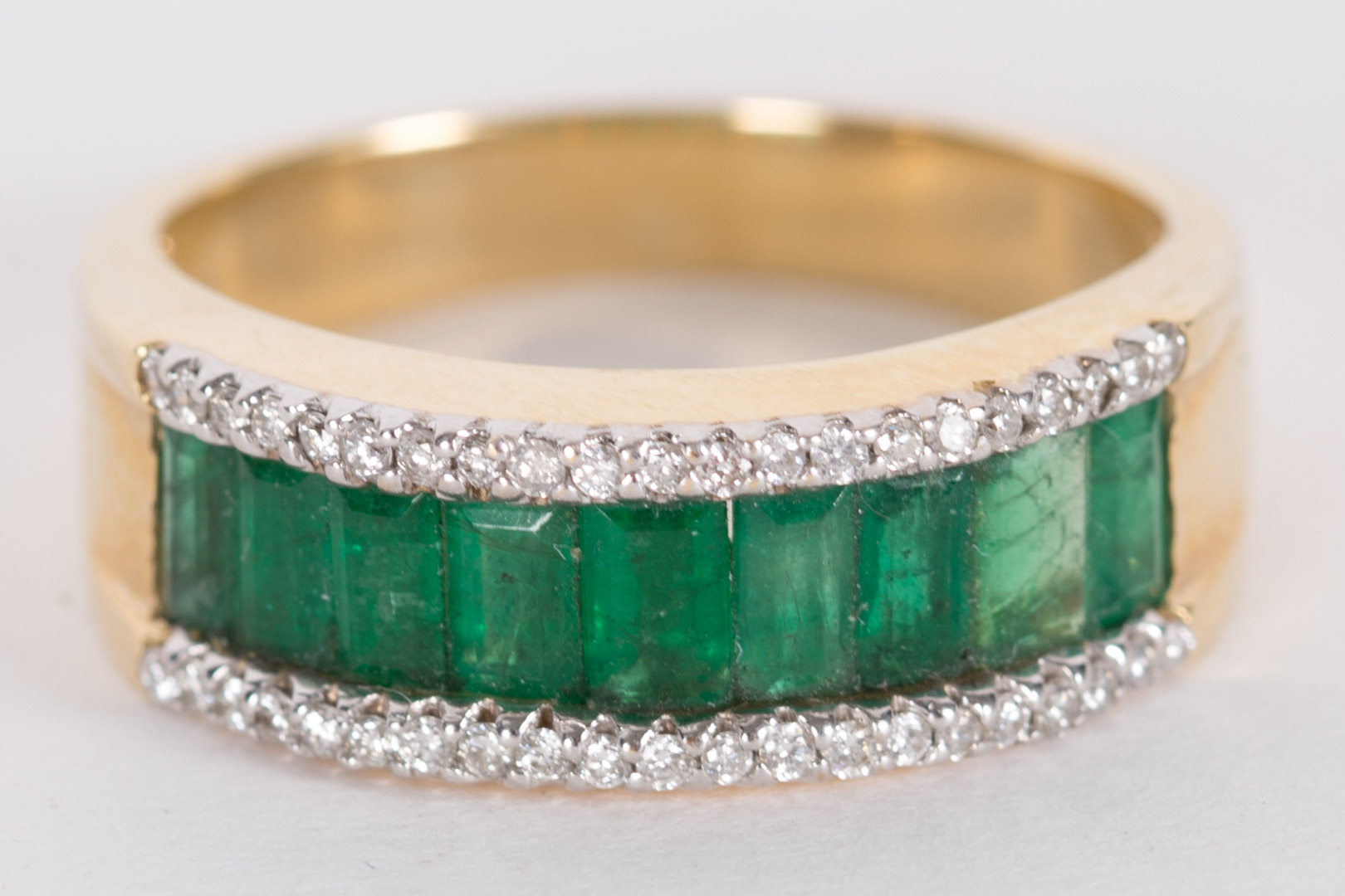 Appraisal: An Emerald Gold Ring set in K with cluster of