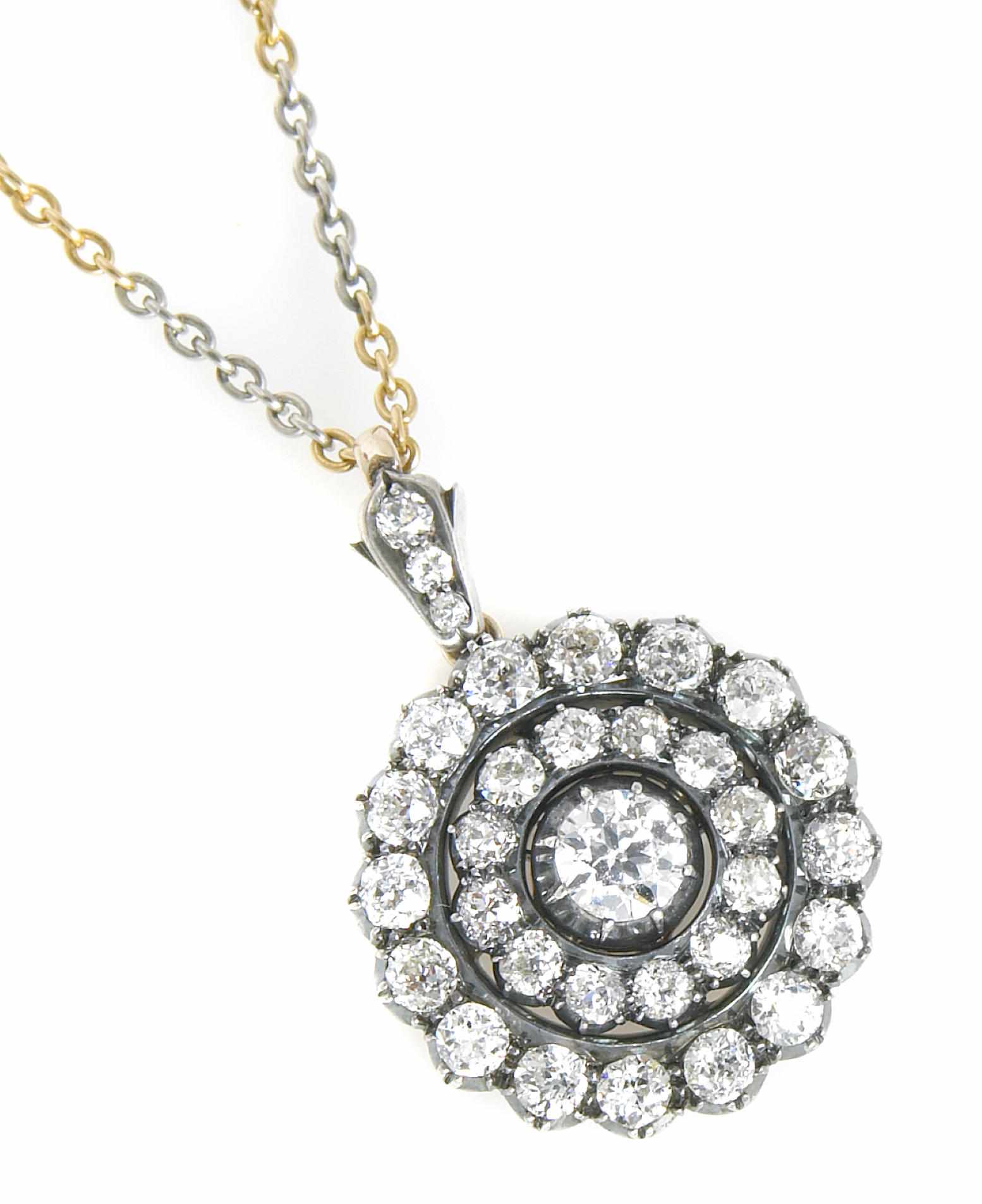 Appraisal: An old European-cut diamond and silver-topped gold pendant-brooch accompanied with