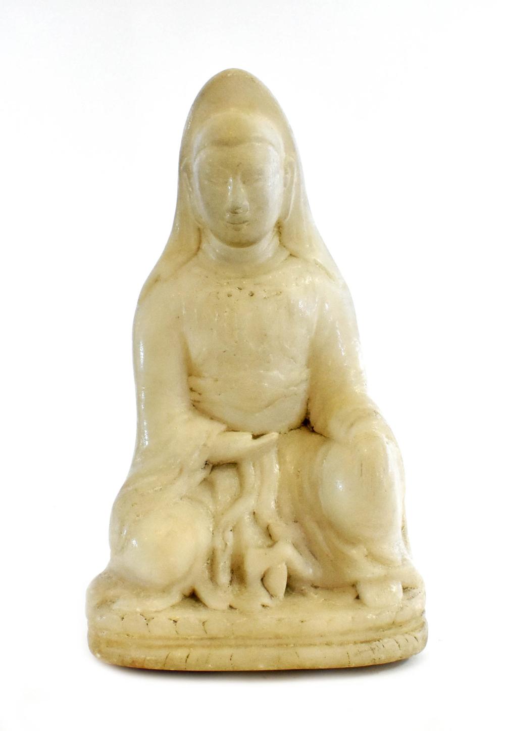 Appraisal: CHINESE CARVED MARBLE SEATED PRIEST DEITYIn a Sui dynasty style