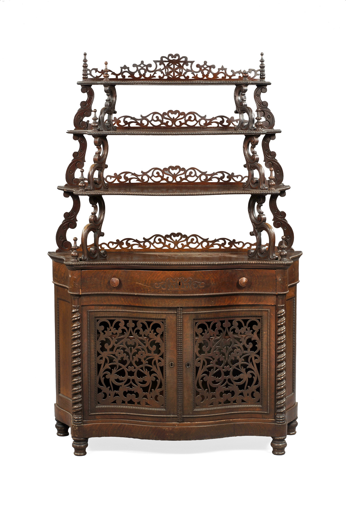 Appraisal: VICTORIAN WALNUT ETAGERE The three serpentine graduated shelves on carved