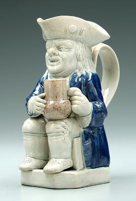 Appraisal: th century Toby jug seated figure with blue coat and