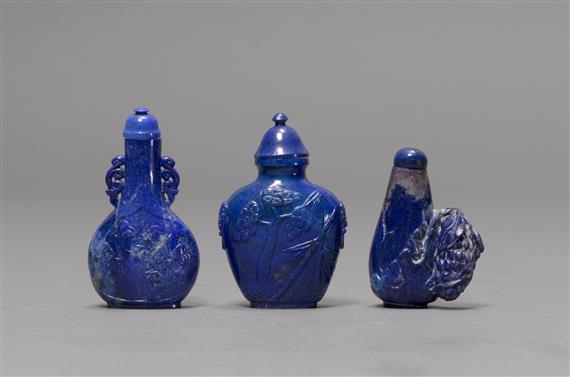 Appraisal: THREE SNUFF BOTTLES OF CARVED LAPIS LAZULI China H -