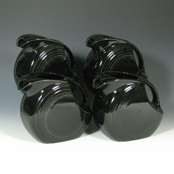 Appraisal: Four Fiesta large disk pitchers in Black Marked HLC Fiesta