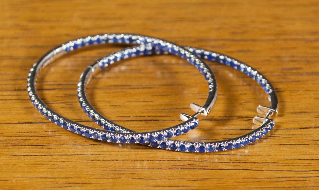 Appraisal: PAIR OF SAPPHIRE AND WHITE GOLD HOOP EARRINGS each large