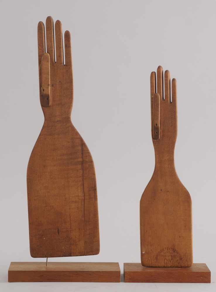 Appraisal: TWO AMERICAN MAPLE GLOVE FORMS Each stamped Wisconsin Textile Mfg