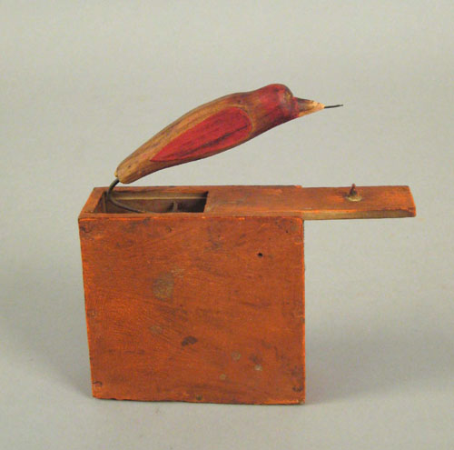 Appraisal: Pennsylvania painted bird in box trick toy th c retaining