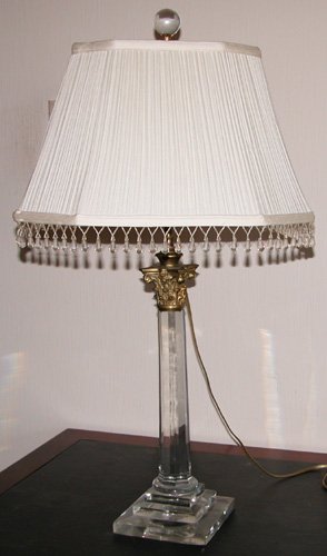 Appraisal: Artist Title Faceted crystal columnar lamp with a gilded Corinthian