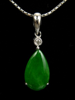 Appraisal: An Intense Green Jade Pendant with an Accent Diamond k