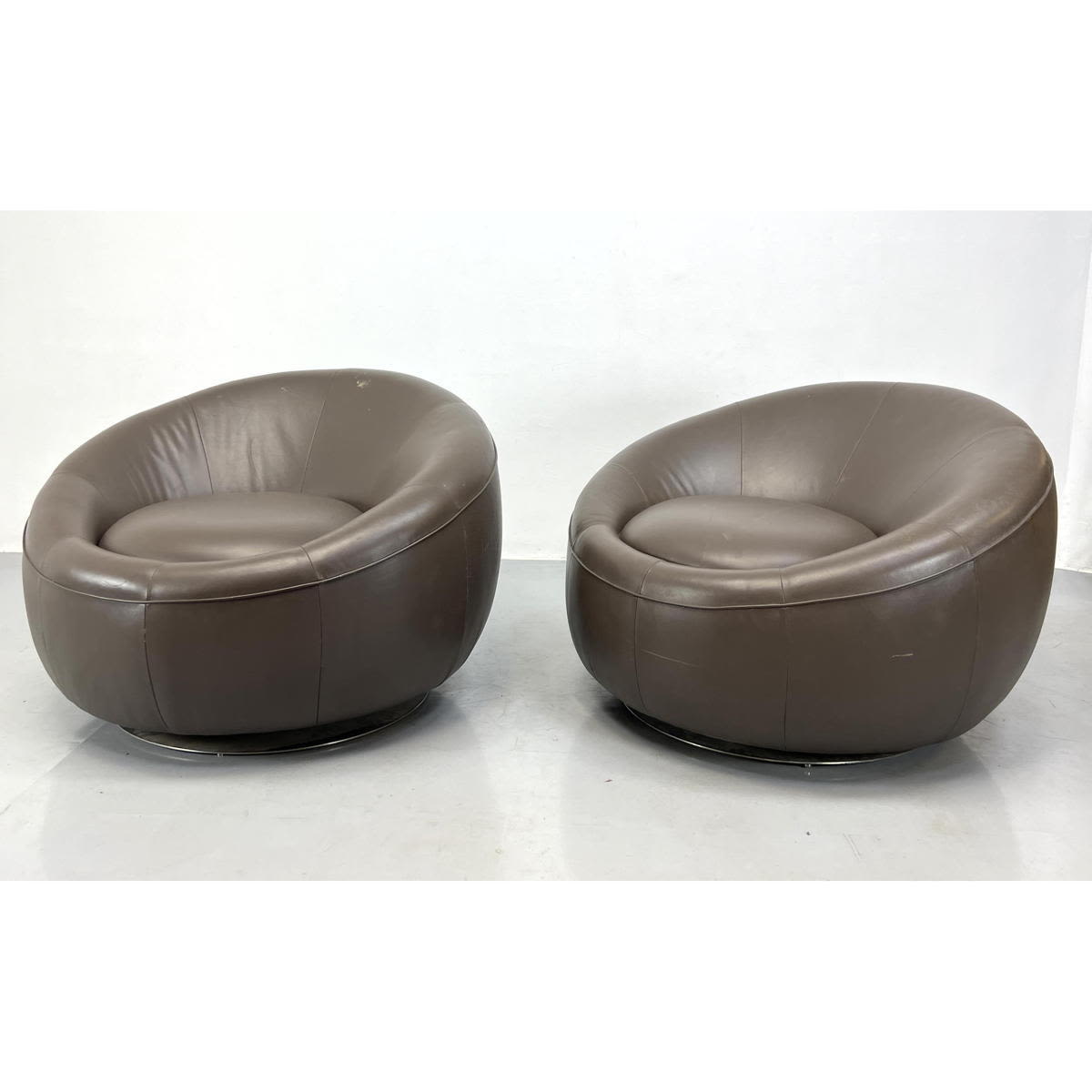 Appraisal: Pair Large Oversized Round Leather Lounge Chairs Swivel with steel