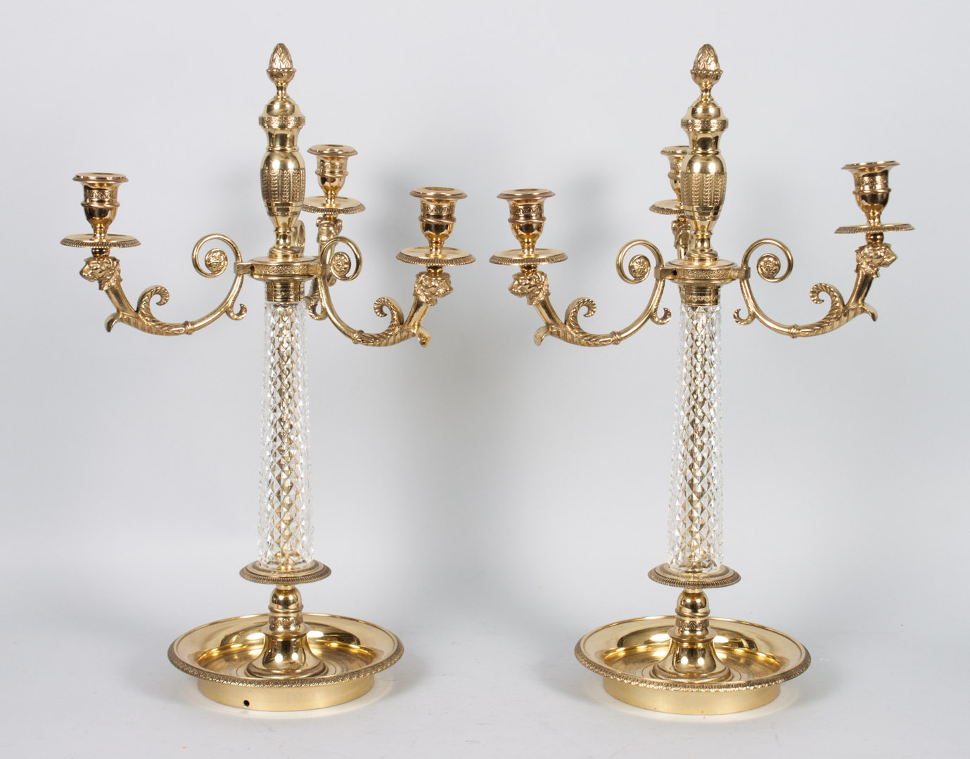 Appraisal: Pair of French brass and crystal candelabra Empire style three-light