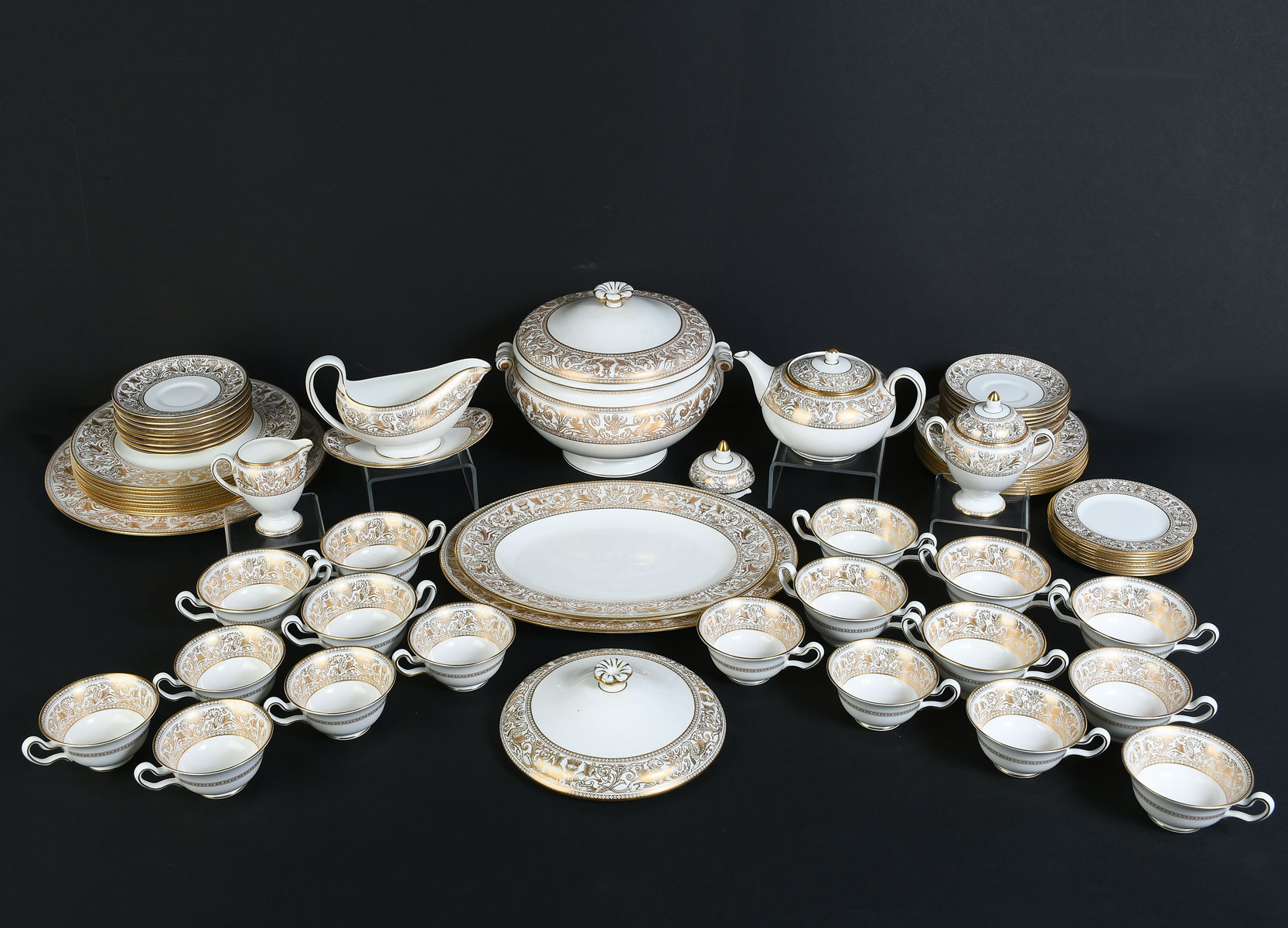 Appraisal: WEDGEWOOD ''GOLD FLORENTINE'' CHINA SET Comprising - Tea cups -