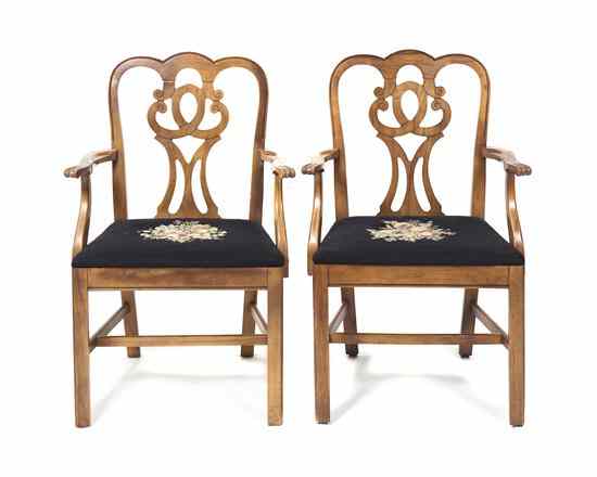 Appraisal: A Pair of American Walnut Armchairs the vertical pierced splats