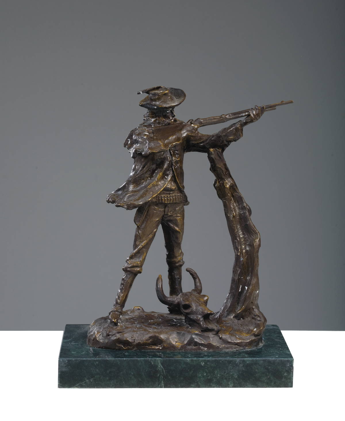 Appraisal: BRONZE FIGURE OF A SHARP SHOOTER AFTER CHARLES M RUSSELL