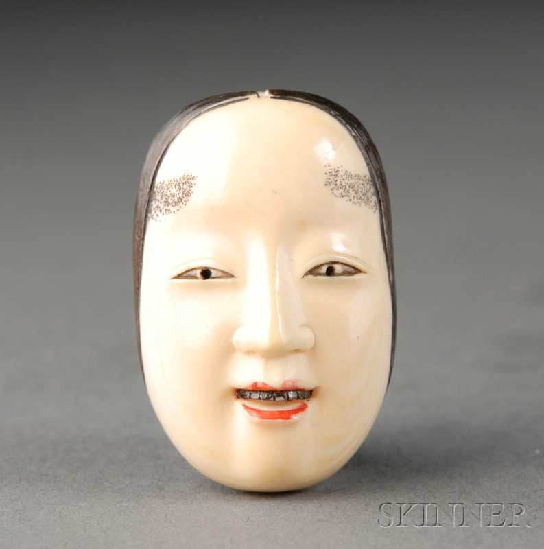 Appraisal: Ivory Mask Netsuke th century stained details lg in