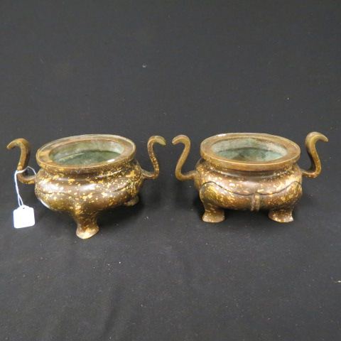 Appraisal: Pair of Oriental Bronze Splash Gold IncenseBurners signed footed handled