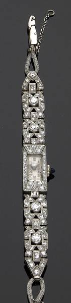 Appraisal: A ladies diamond and platinum bracelet wristwatch dial marked Opera