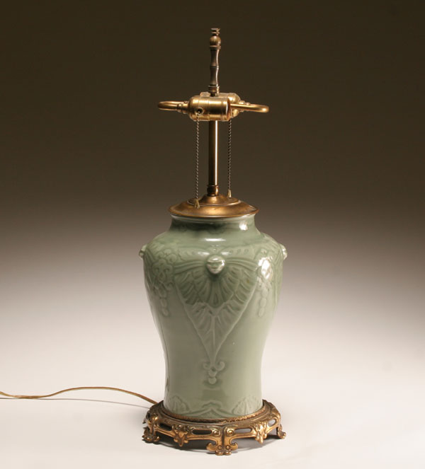 Appraisal: Celadon glazed porcelain table lamp with lion head prunts to