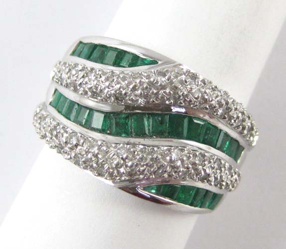 Appraisal: EMERALD DIAMOND AND FOURTEEN KARAT WHITE GOLD RING The heavy