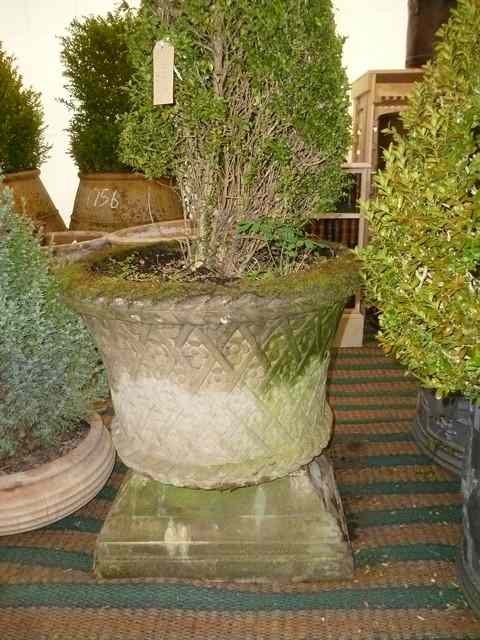 Appraisal: A HADDONSTONE CYLINDRICAL PLANTER with rope twist decoration to the