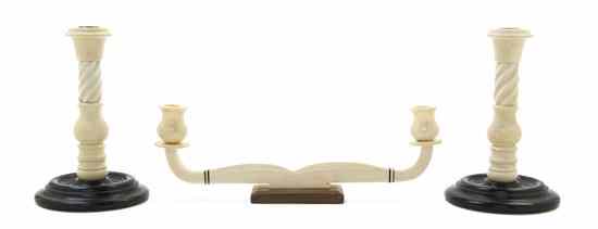 Appraisal: A Pair of Carved Ivory Candlesticks having twist carved standards