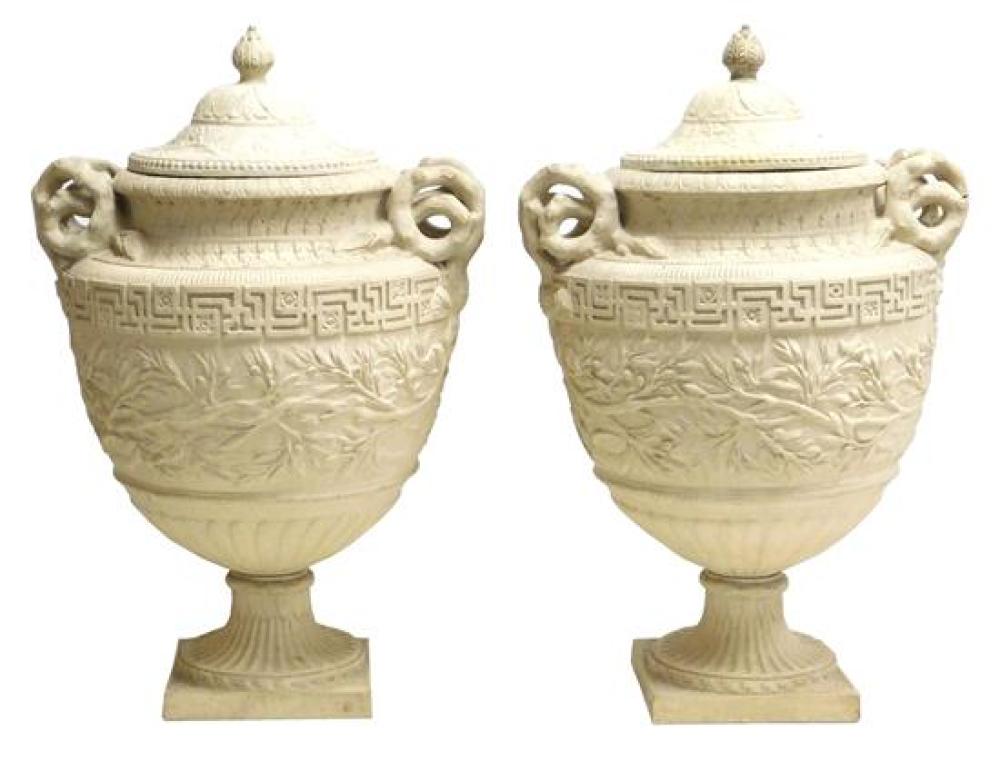 Appraisal: Pair of cast cement garden urns with covers curled branch