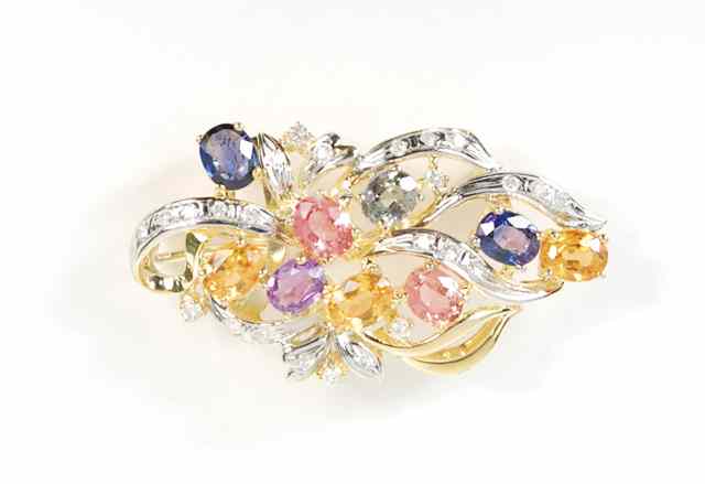 Appraisal: SAPPHIRE AND DIAMOND PENDANT BROOCH k yellow gold set with