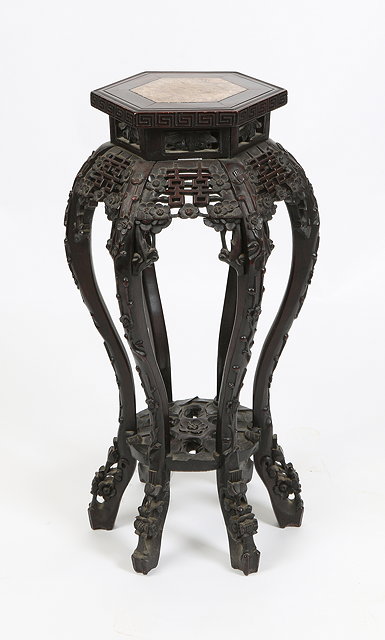 Appraisal: A CHINESE HEXAGONAL URN STAND with marble inset top carved