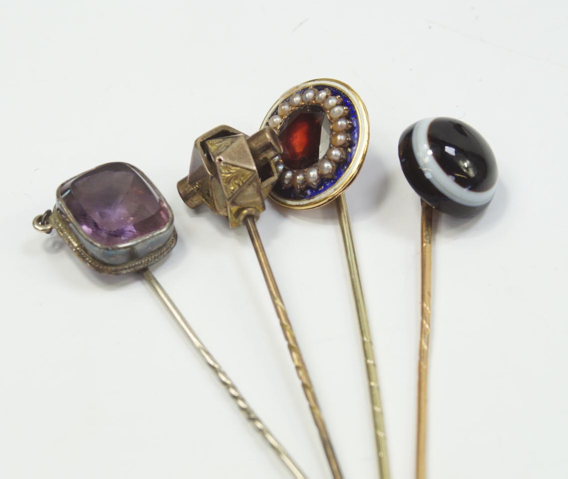 Appraisal: A Victorian bull's eye agate stick pin and three other