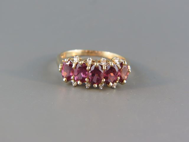 Appraisal: Garnet Diamond Ring five purplish red oval gems and small