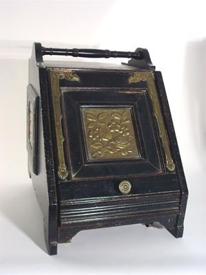 Appraisal: A large Aesthetic Movement coal scuttle with brass furniture and