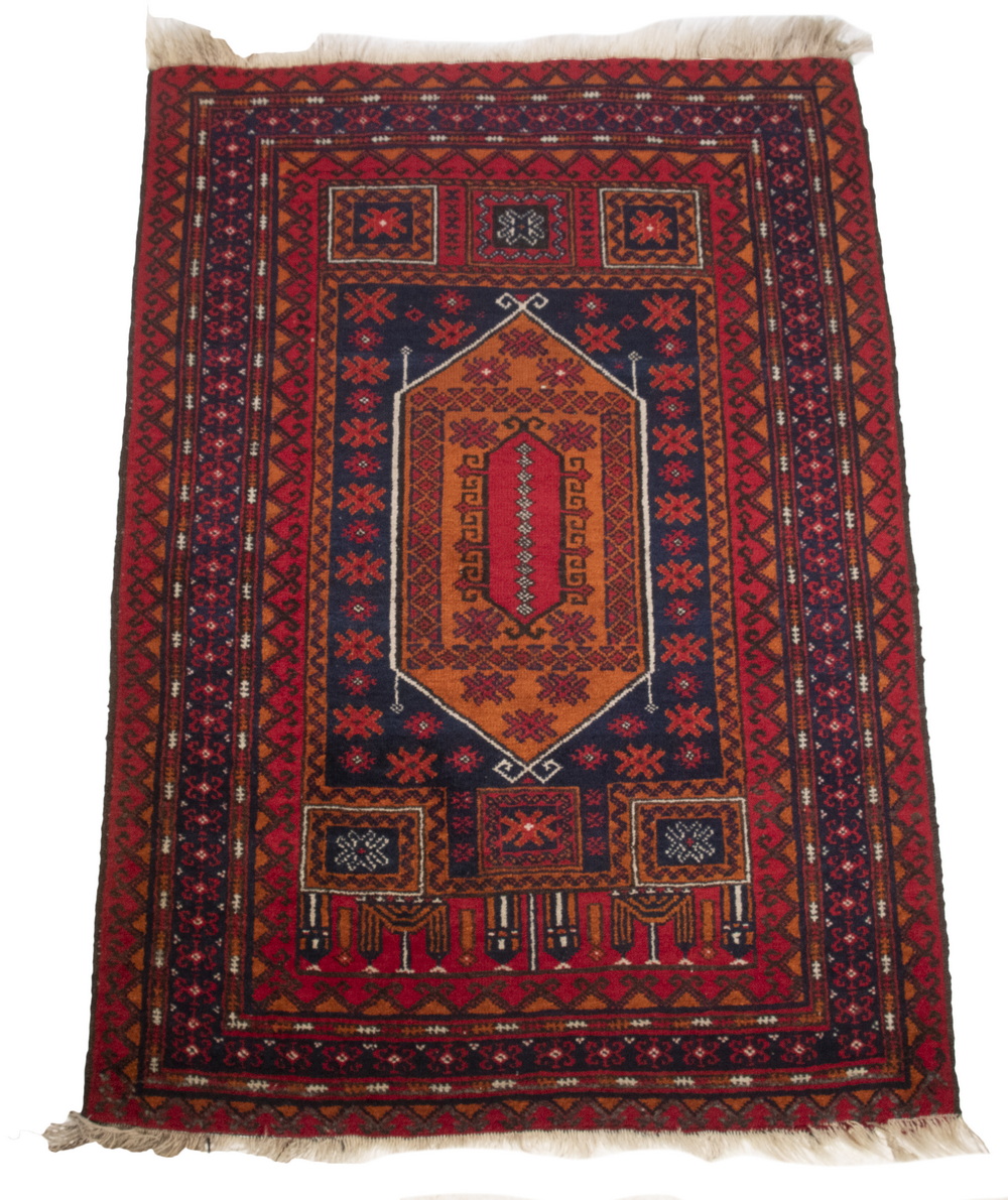 Appraisal: BALUCH STYLE RUG A light tomato hexagonal medallion surrounded by