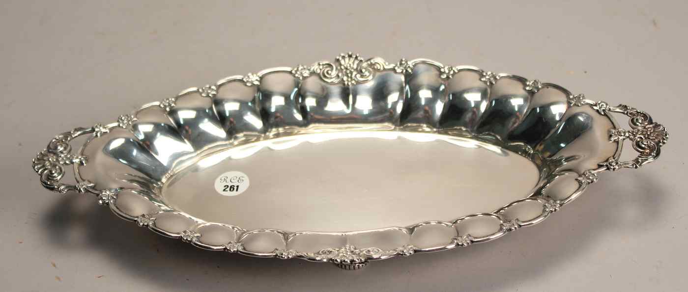 Appraisal: TIFFANY STERLING SILVER TWO-HANDLED CELERY DISHWith applied scroll and flower