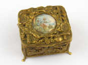 Appraisal: A natuaralistic gilt metal box the lid set with a