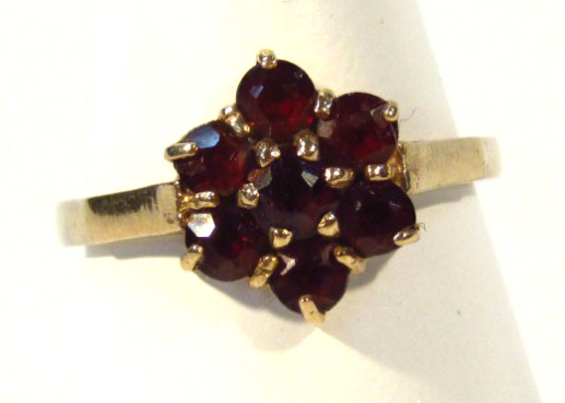 Appraisal: A ct gold dress ring florally set with small garnets