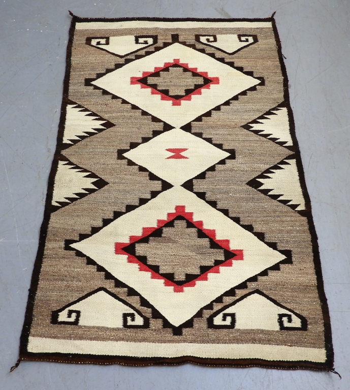 Appraisal: NAVAJO NATIVE AMERICAN DIAMOND GEOMETRIC RUG United States th CenturyBrown