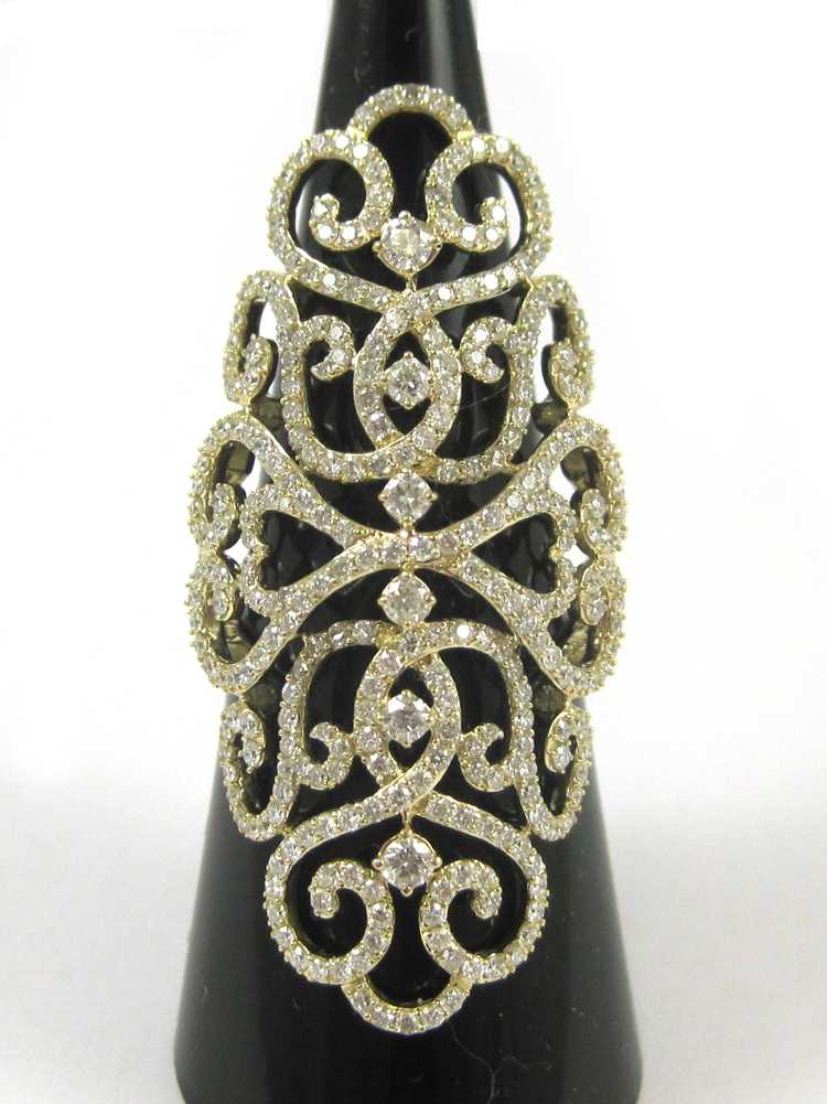 Appraisal: DIAMOND AND FOURTEEN KARAT GOLD RING with pave' set round-cut