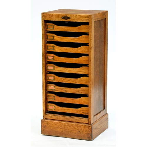 Appraisal: An oak office filing cabinet c fitted nine trays enclosed