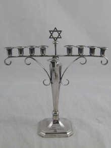 Appraisal: An Art Deco silver menorah cm across x cm high